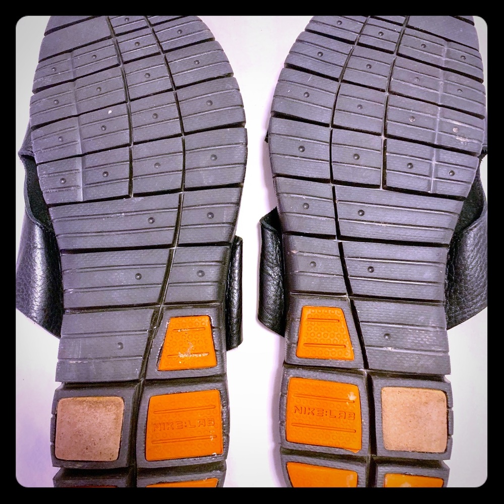 A pair of Cole Haan Leather Slippers